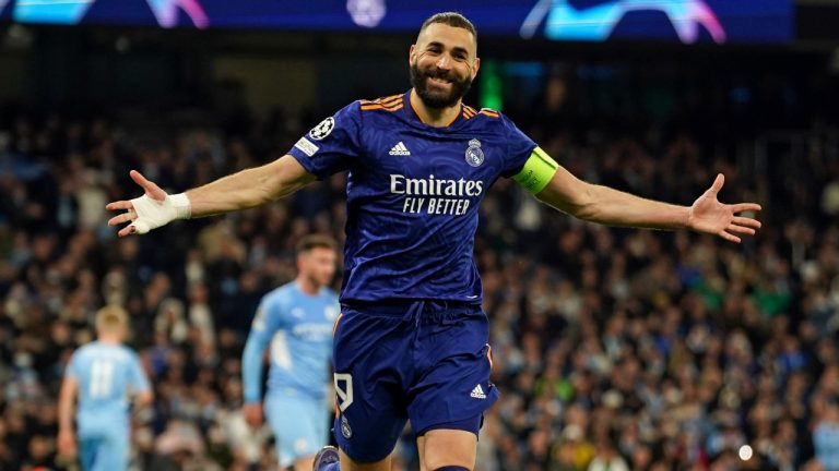 Real Madrid's Karim Benzema celebrates after scoring his side's third goal from penalty during the Champions League semi final, first leg soccer match between Manchester City and Real Madrid at the Etihad stadium in Manchester, England, Tuesday, April 26, 2022. (Dave Thompson/AP)