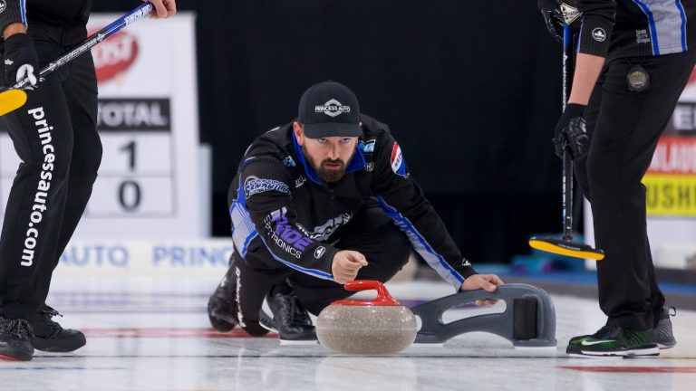 Reid Carruthers shoots a stone during the 2021 Boost National in Chestermere, Alta. (Anil Mungal)