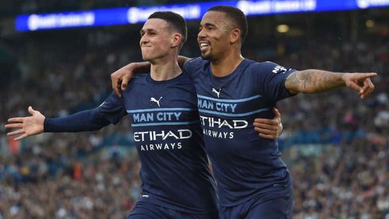 Manchester City's Gabriel Jesus, right, celebrates with Phil Foden after scoring his side's third goal during the English Premier League soccer match against Leeds United at Elland Road in Leeds, England on Saturday. (Rui Vieira/AP)