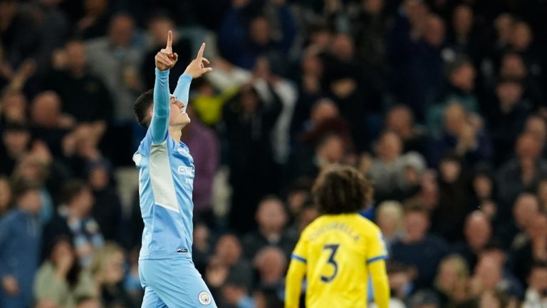 Manchester City's Phil Foden celebrates after scoring his side's second goal during the English Premier League soccer match between Manchester City and Brighton and Hove Albion at the Etihad Stadium in Manchester, England, Wednesday, April 20, 2022. (Dave Thompson/AP)