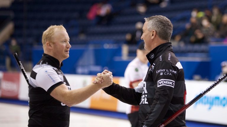 Scott Howard (left) and Wayne Middaugh (right) celebrate after winning during Draw 7 of the Princess Auto Players' Championship at Toronto's Mattamy Athletic Centre. (Anil Mungal)