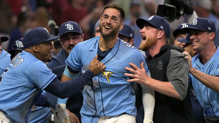 Former Tampa Bay Rays' Kevin Kiermaier, center, is swarmed by teammates after hitting a walkoff two-run home run during the 10th inning of a baseball game to get the win over the Boston Red Sox. (Phelan M. Ebenhack/AP)