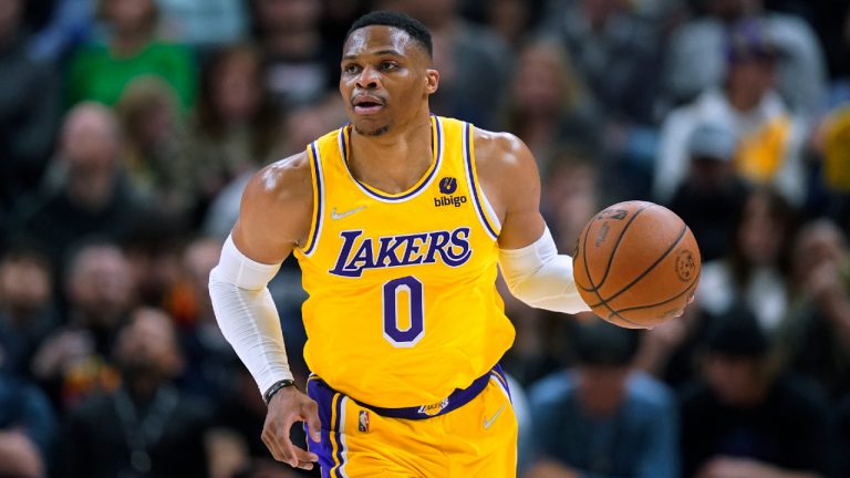 Former Los Angeles Lakers guard Russell Westbrook brings the ball up during the first half of the team's NBA basketball game against the Utah Jazz on Thursday, March 31, 2022, in Salt Lake City. (AP Photo/Rick Bowmer) 