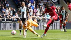 Liverpool wins at Newcastle to keep pressure on Manchester City