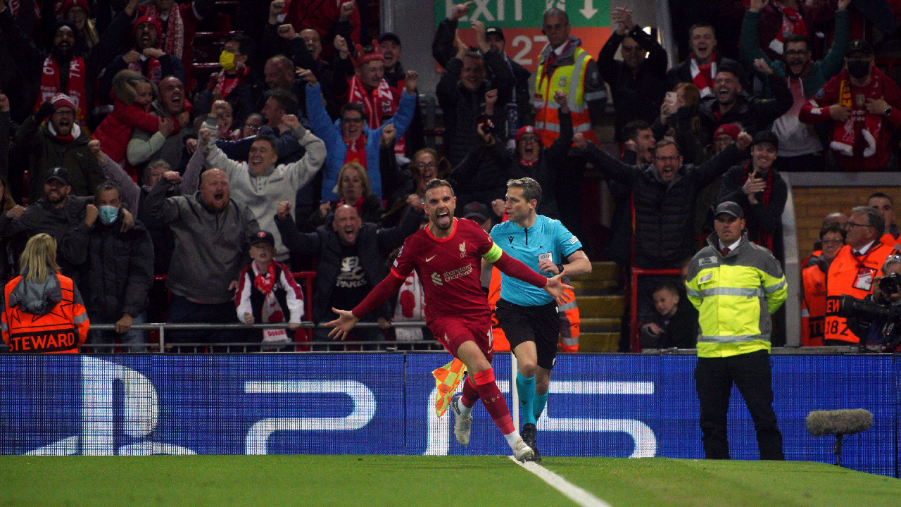 Liverpool's Jordan Henderson celebrates after Villarreal's Pervis Estupinan scored an own goal during the Champions League semi final, first leg soccer match between Liverpool and Villarreal at Anfield stadium in Liverpool, England, Wednesday, April 27, 2022. (PA via AP) 