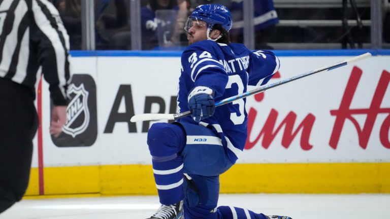 Toronto Maple Leafs centre Auston Matthews (34) celebrates after scoring on the Detroit Red Wings during third period NHL hockey action in Toronto, Tuesday, April 26, 2022. It is 60th goal of the season for Matthews. (Frank Gunn/CP)