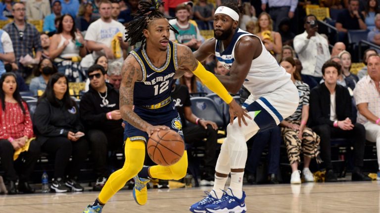 Memphis Grizzlies guard Ja Morant (12) handles the ball against Minnesota Timberwolves guard Patrick Beverley in the first half during Game 5 of a first-round NBA basketball playoff series Tuesday, April 26, 2022, in Memphis, Tenn. (Brandon Dill/AP)