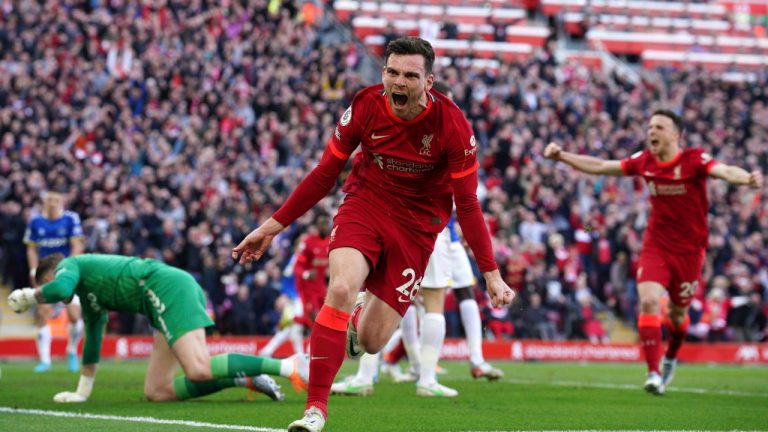 Liverpool's Andrew Robertson celebrates after scoring his sides first goal during the English Premier League soccer match between Liverpool and Everton at Anfield stadium in Liverpool, England, Sunday, April 24, 2022. (Peter Byrne/PA via AP)