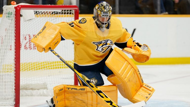 Nashville Predators goaltender Juuse Saros blocks a shot against the Calgary Flames in the first period of an NHL hockey game Tuesday, April 19, 2022, in Nashville, Tenn. (Mark Humphrey/AP)