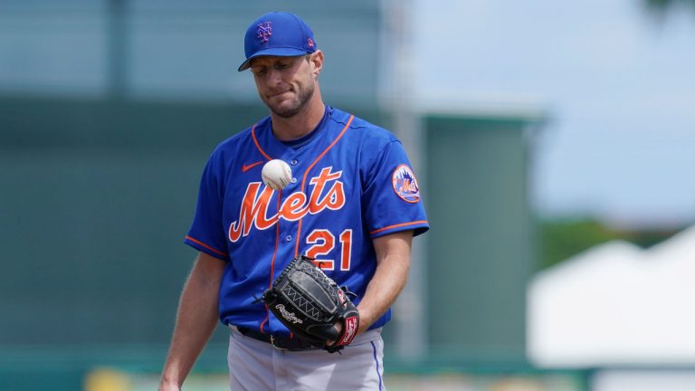 New York Mets' Max Scherzer flips the ball around in the second inning of a spring training baseball game against the Miami Marlins. (Sue Ogrocki/AP)