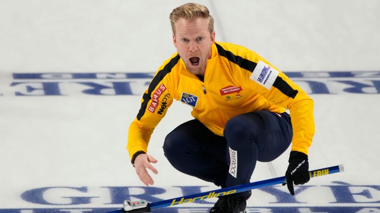 Sweden skip Niklas Edin yells towards his sweepers during a gold medal game against Canada at the World Men's Curling Championship. (John Locher/AP)