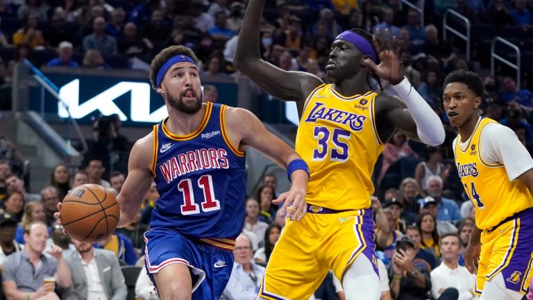 Golden State Warriors guard Klay Thompson (11) drives to the basket against Los Angeles Lakers forward Wenyen Gabriel (35) during the second half of an NBA basketball game in San Francisco, Thursday, April 7, 2022. (Jeff Chiu/AP)