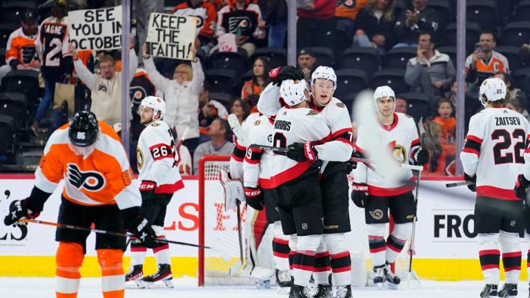 Ottawa Senators' Brady Tkachuk (7) and Josh Norris (9) celebrate after an NHL hockey game against the Philadelphia Flyers, Friday, April 29, 2022, in Philadelphia. (Matt Slocum/AP)