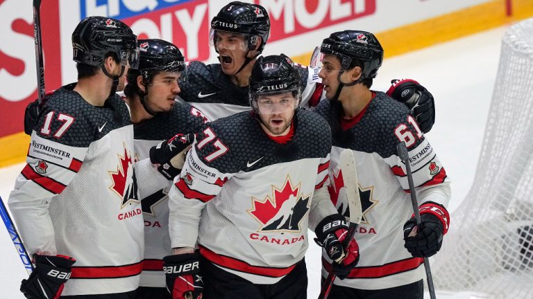 Josh Anderson of Canada, center front, celebrates with teammates after he scored his side's second goal during the group A Hockey World Championship match between Italy and Canada in Helsinki, Finland, Sunday May 15, 2022. (Martin Meissner/AP)