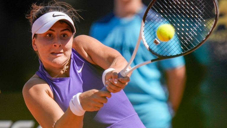 Bianca Andreescu of Canada returns the ball to Iga Swiatek of Poland during their match at the Italian Open tennis tournament, in Rome, Friday, May 13, 2022. (Andrew Medichini/AP Photo)