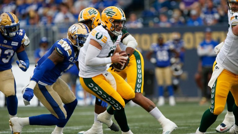 Edmonton Elks quarterback Nick Arbuckle (9) looks downfield against the Winnipeg Blue Bombers during the first half of pre-season CFL action in Winnipeg, Friday, May 27, 2022. (John Woods/THE CANADIAN PRESS)