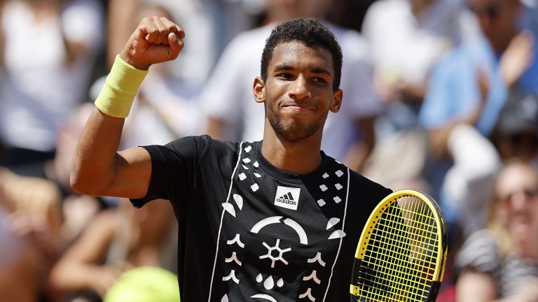 Canada's Felix Auger-Aliassime clenches his fist after defeating Argentina's Camilo Ugo Carabelli during their second round match of the French Open tennis tournament. (Jean-Francois Badias/AP)