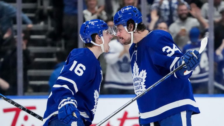 Toronto Maple Leafs forward Auston Matthews (34) reacts with teammate Toronto Maple Leafs forward Mitchell Marner (16) after scoring the game winning goal against then Tampa Bay Lightning during third period, round one, NHL Stanley Cup playoff hockey action in Toronto on Tuesday, May 10, 2022. (Nathan Denette/CP)