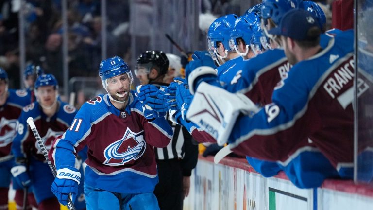 Colorado Avalanche centre Andrew Cogliano (11) is congratulated for his goal against the Nashville Predators during the first period in Game 1 of an NHL hockey Stanley Cup first-round playoff series Tuesday, May 3, 2022, in Denver. (Jack Dempsey/AP Photo)