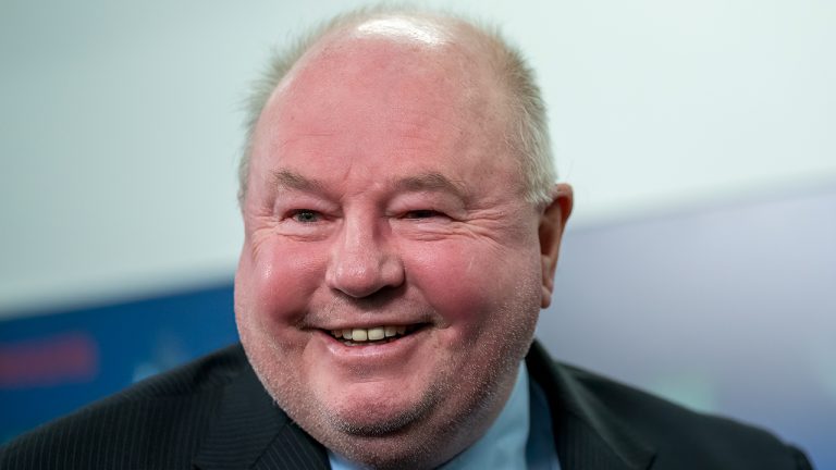 Vancouver Canucks new head coach Bruce Boudreau smiles as he attends a news conference in Vancouver, B.C., Monday, Dec. 6, 2021. (Jonathan Hayward/CP)