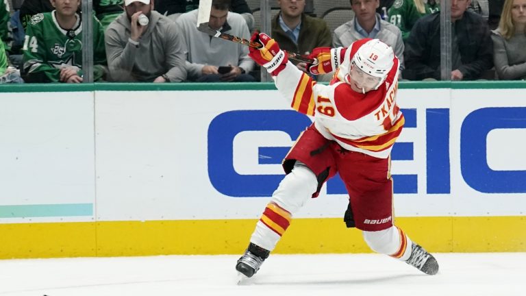 Calgary Flames left wing Matthew Tkachuk takes a shot at the net in the second period of an NHL hockey game against the Dallas Stars in Dallas, Tuesday, Feb. 1, 2022. (AP Photo/Tony Gutierrez)