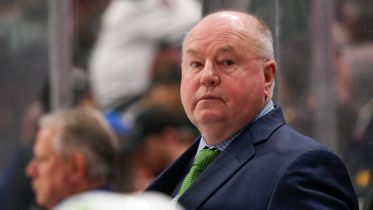 Vancouver Canucks coach Bruce Boudreau watches the team play against the Minnesota Wild during the third period of an NHL hockey game Thursday, April 21, 2022, in St. Paul, Minn. The Wild won 6-3. (AP)