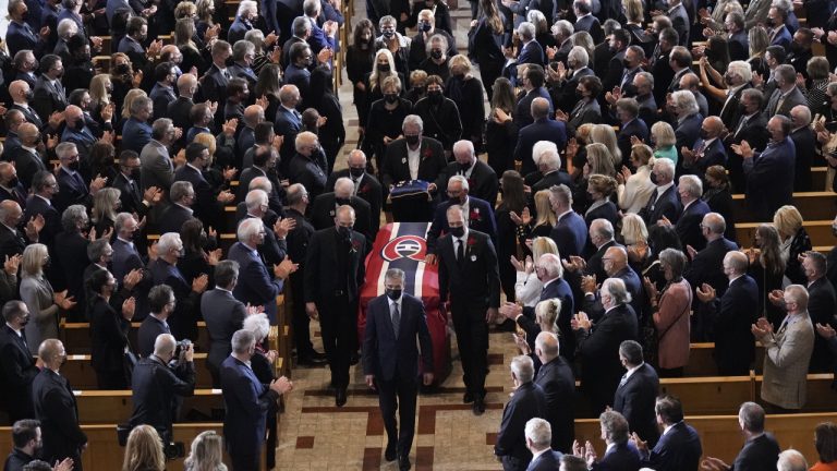 Pallbearers carry the casket of former Montreal Canadiens hockey player Guy Lafleur, following the funeral service in Montreal on Tuesday, May 3, 2022. THE CANADIAN PRESS/Paul Chiasson