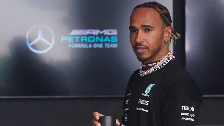 Mercedes driver Lewis Hamilton of Britain arrives for the first practice session for the Formula One Miami Grand Prix auto race wearing various items of jewelry at the Miami International Autodrome, Friday, May 6, 2022, in Miami Gardens, Fla. (AP)