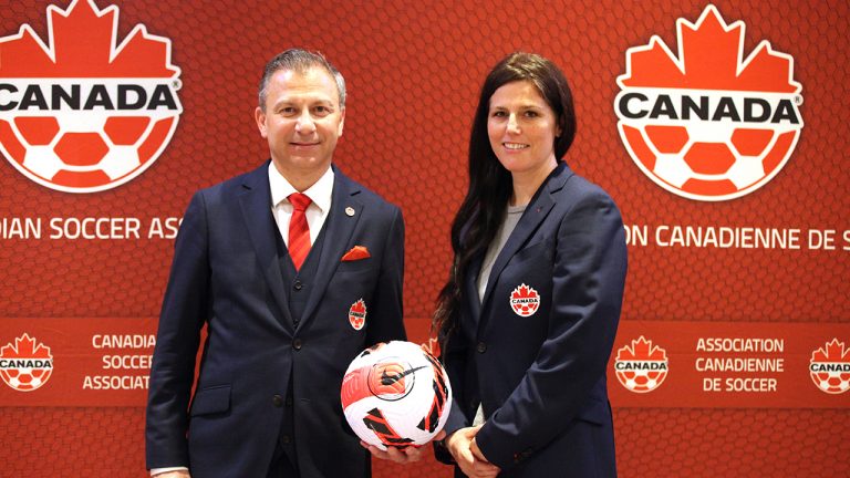 Canada Soccer president Nick Bontis and Breagha Carr-Harris, Canada Soccer's newly appointed head of women's professional soccer, pose for a photo at the Canadian Soccer Association's annual general meeting, in Winnipeg, in a May 7, 2022, handout photo. (THE CANADIAN PRESS/HO-Canada Soccer)