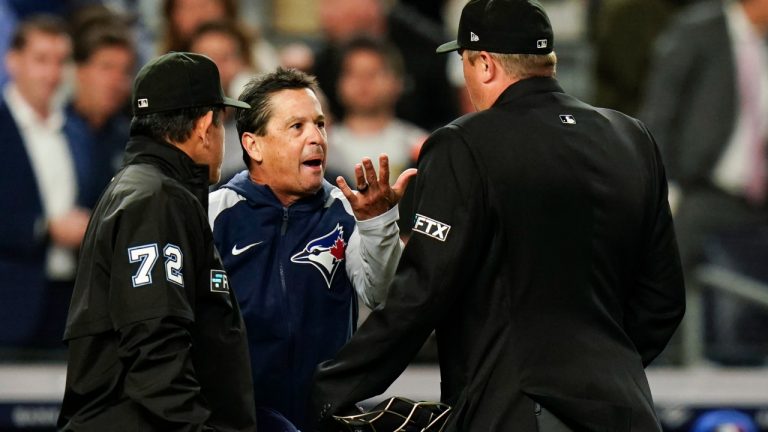 Toronto Blue Jays manager Charlie Montoyo argues with umpires Alfonso Marquez (72) and Lance Barrett after Toronto Blue Jays relief pitcher Yimi Garcia was ejected from the game during the sixth inning of a baseball game against the New York Yankees, Tuesday, May 10, 2022, in New York. (AP Photo/Frank Franklin II)