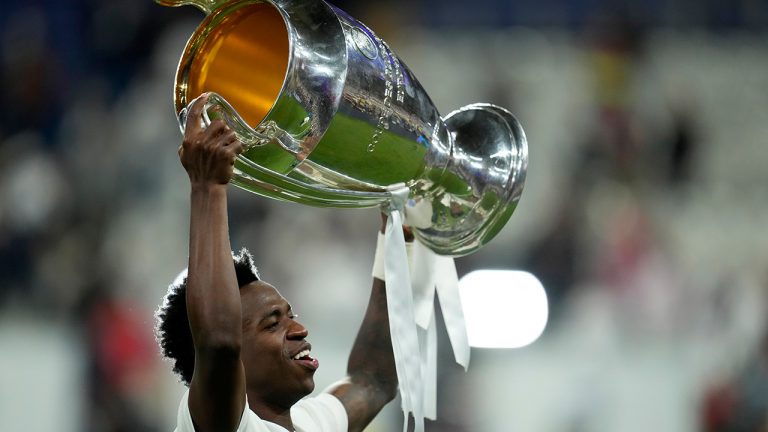 Real Madrid's Vinicius Junior celebrates with the trophy after winning the Champions League final soccer match between Liverpool and Real Madrid at the Stade de France in Saint Denis near Paris, Sunday, May 29, 2022. Real Madrid defeated Liverpool 1-0. (Manu Fernandez/AP)