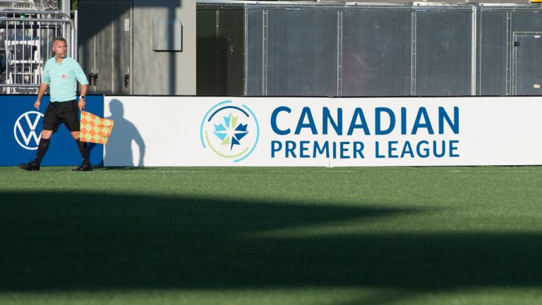 A referee for the Canadian Premier League follows the play down the field during a CPL soccer match between York United FC and Forge Hamilton FC, (Tijana Martin/CP)