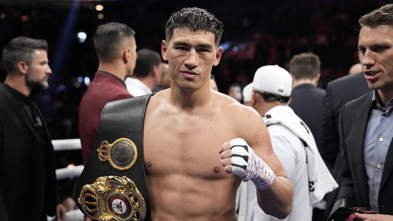 Dmitry Bivol, of Kyrgyzstan, celebrates after winning a light heavyweight title boxing match against Canelo Alvarez, of Mexico. (John Locher/AP)