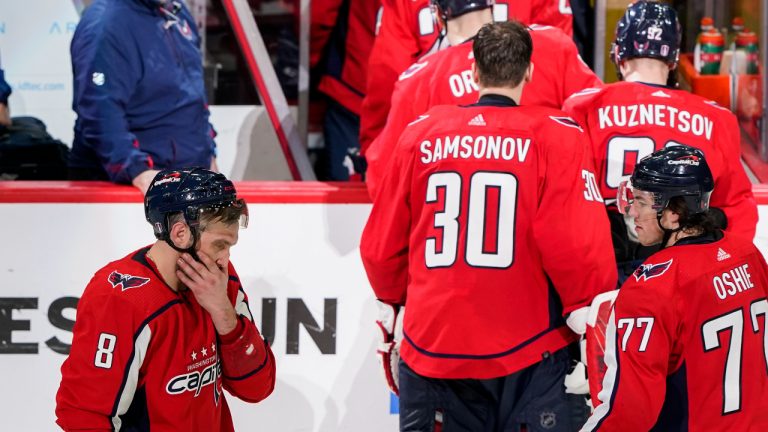 Washington Capitals left wing Alex Ovechkin (8) and right wing T.J. Oshie (77) prepare to leave the ice after Game 6 in the first round of the NHL Stanley Cup hockey playoffs against the Florida Panthers, Friday, May 13, 2022, in Washington. (Alex Brandon/AP)