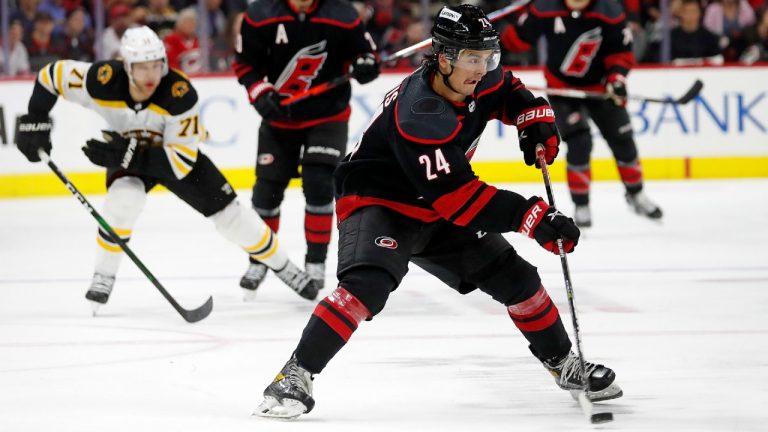 Carolina Hurricanes' Seth Jarvis (24) moves the puck up the ice against the Boston Bruins during the second period of Game 1 of an NHL hockey Stanley Cup first-round playoff series in Raleigh, N.C., Monday, May 2, 2022. (Karl B DeBlaker/AP)