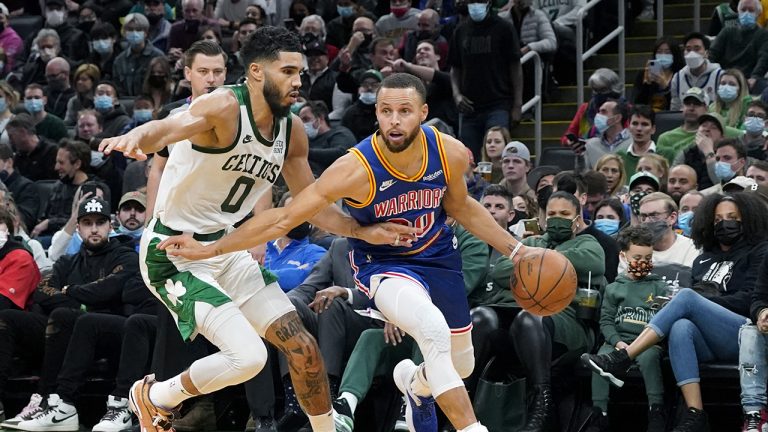 Golden State Warriors guard Stephen Curry (30) drives against Boston Celtics forward Jayson Tatum (0) during the second half of an NBA basketball game. (Mary Schwalm/AP)