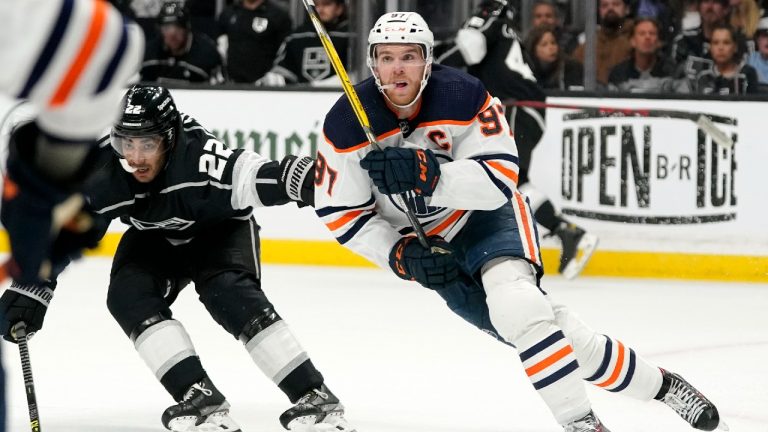 Edmonton Oilers center Connor McDavid, right, skates while being followed by Los Angeles Kings center Andreas Athanasiou during the second period in Game 6 of an NHL hockey Stanley Cup first-round playoff series Thursday, May 12, 2022, in Los Angeles. (AP)