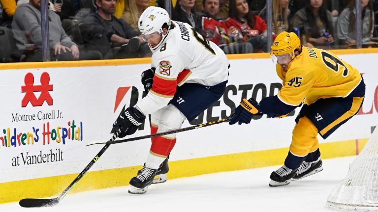 Florida Panthers defenceman Ben Chiarot (8) moves the puck in front of Nashville Predators centre Matt Duchene (95). (Mark Zaleski/AP)