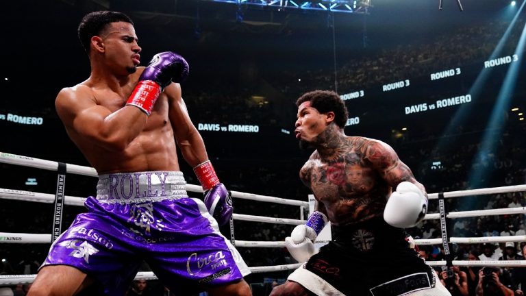 Rolando Romero, left, leans back during the third round against Gervonta Davis in a WBA lightweight championship boxing bout early Sunday, May 29, 2022, in New York. Davis won in the sixth round. (Frank Franklin II/AP)