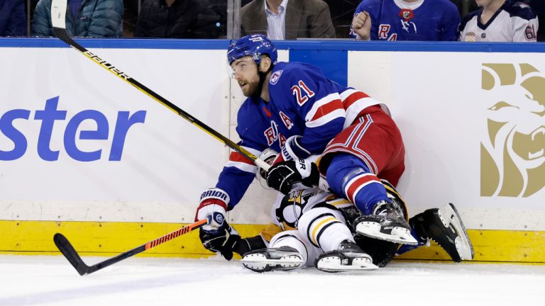 New York Rangers center Barclay Goodrow (21) checks Pittsburgh Penguins centre Evan Rodrigues during the first period of Game 1 of an NHL hockey Stanley Cup first-round playoff series Tuesday, May 3, 2022, in New York. (Adam Hunger/AP)