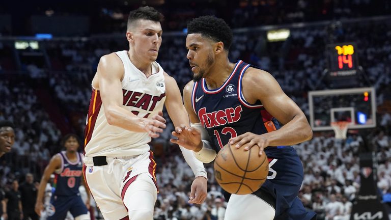 Philadelphia 76ers forward Tobias Harris (12) drives to the basket as Miami Heat guard Tyler Herro (14) defends, during the first half of Game 1 of an NBA basketball second-round playoff series. (Marta Lavandier/AP)