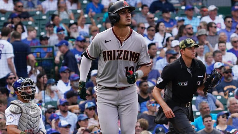 Arizona Diamondbacks' Josh Rojas watches his solo home run during the seventh inning of a baseball game against the Chicago Cubs in Chicago, Friday, May 20, 2022. (AP)