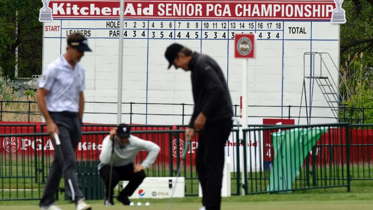 Golfers work the practice green at the Senior PGA Championship golf tournament, Wednesday, May 25, 2022, at Harbor Shores in Benton Harbor, Mich. (Don Campbell/AP)