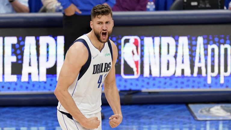 Dallas Mavericks forward Maxi Kleber celebrates after sinking a three-point basket. (Tony Gutierrez/AP)