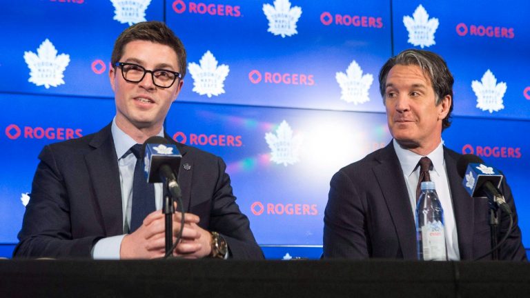 Toronto Maple Leafs general manager Kyle Dubas, left, sits alongside president and alternate governor Brendan Shanahan during a news conference. (Chris Young/CP)