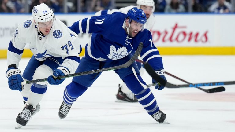 Toronto Maple Leafs forward Colin Blackwell (11) and Tampa Bay Lightning forward Ross Colton (79) battle during first period, round one, NHL Stanley Cup playoff hockey action in Toronto, Monday, May 2, 2022. (Nathan Denette/THE CANADIAN PRESS)