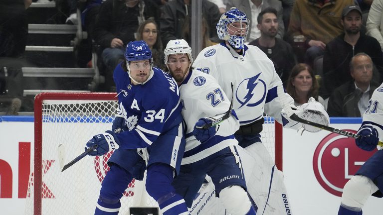 Toronto Maple Leafs centre Auston Matthews (34) and Tampa Bay Lightning defenceman Ryan McDonagh (27) battle in front of Tampa Bay Lightning goaltender Andrei Vasilevskiy (88). (Frank Gunn/CP)