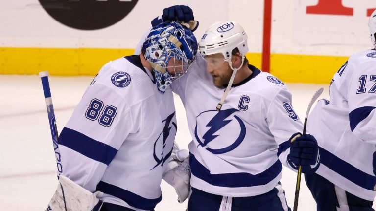 Tampa Bay Lightning centre Steven Stamkos (91) congratulates Tampa Bay Lightning goaltender Andrei Vasilevskiy (88) on his win over the Florida Panthers following Game 1. (AP Photo/AP)