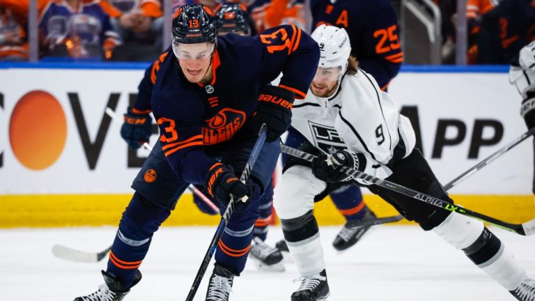 Los Angeles Kings centre Adrian Kempe, right, chases Edmonton Oilers right wing Jesse Puljujarvi during second period NHL playoff hockey action in Edmonton, Tuesday, May 10, 2022. (Jeff McIntosh/CP)