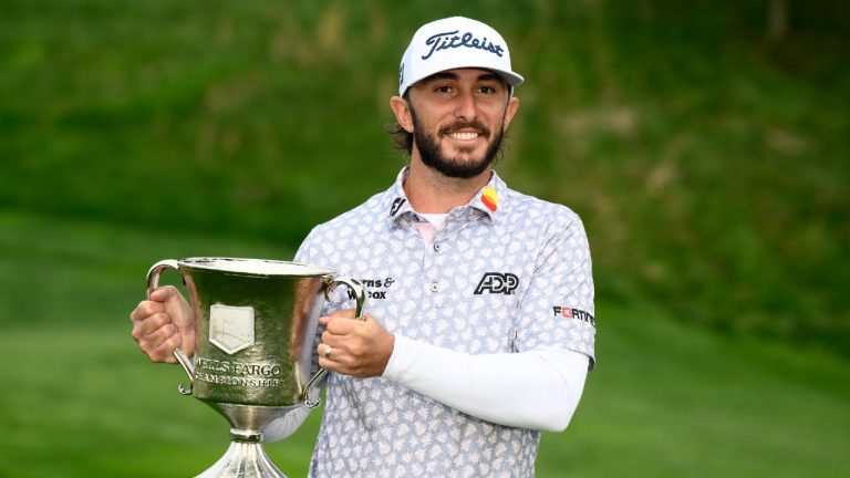 Max Homa holds the trophy after winning the Wells Fargo Championship golf tournament, Sunday, May 8, 2022, at TPC Potomac at Avenel Farm golf club in Potomac, Md. (Nick Wass/AP)